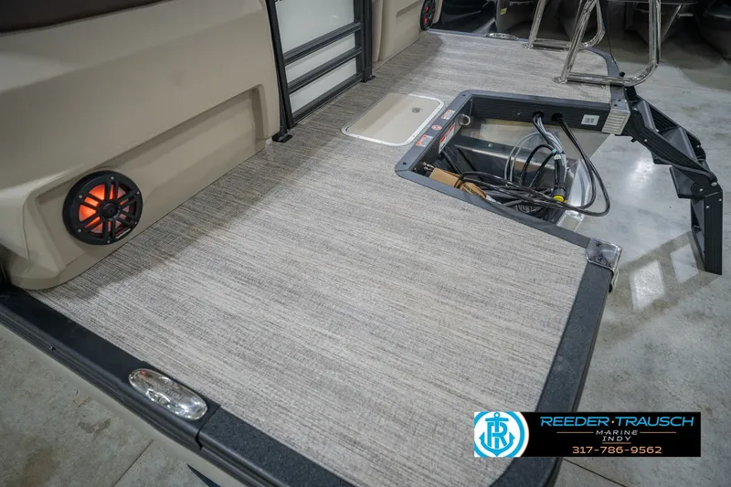 Slide: The Image of 2026 Bennington 24 MSB boat interior with speaker and storage compartment. - 57