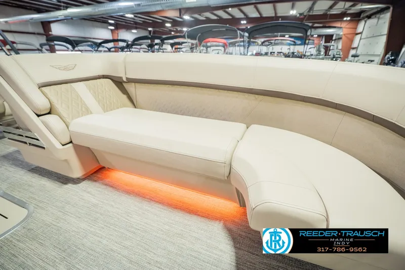 Slide: The Image of Luxurious seating on the 2026 Bennington 24 MSB pontoon boat with ambient lighting. - 49