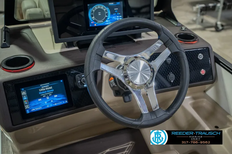 Slide: The Image of Steering wheel and dashboard of 2026 Bennington 24 MSB boat with modern controls. - 39