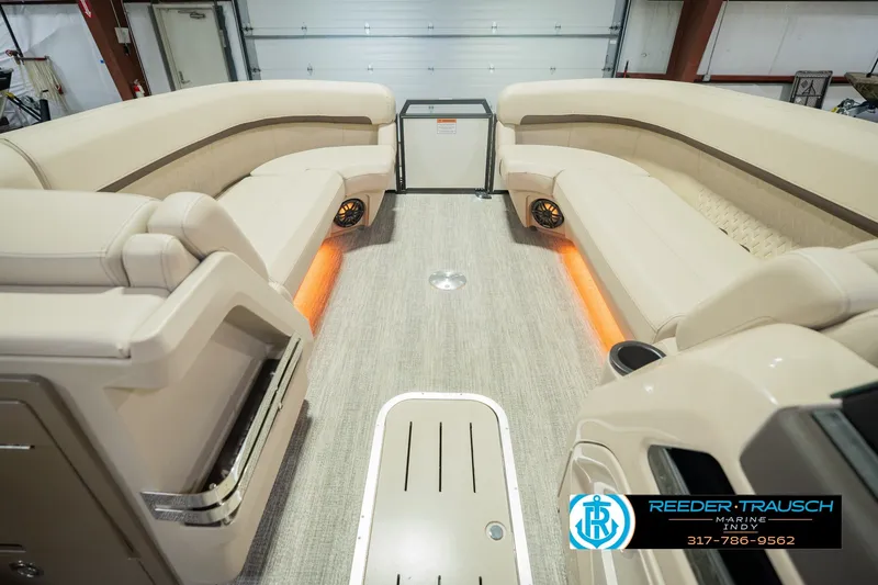 Slide: The Image of Luxurious interior of 2026 Bennington 24 MSB pontoon boat with plush seating and ambient lighting. - 26