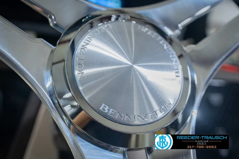 Slide: The Image of Close-up of 2026 Bennington 24 MSB steering wheel with Reeder-Trausch Marine logo. - 40