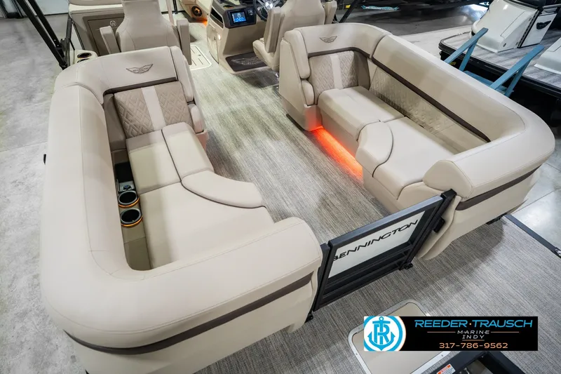 Slide: The Image of Luxurious interior of 2026 Bennington 24 MSB pontoon boat with plush seating and ambient lighting. - 17