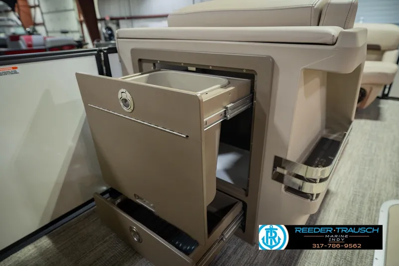 Slide: The Image of 2026 Bennington 24 MSB boat interior with open storage compartment and sleek design. - 32