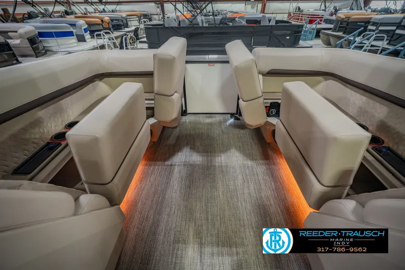 Slide: The Image of Luxurious interior of 2026 Bennington 24 MSB pontoon boat with plush seating and ambient lighting. - 37