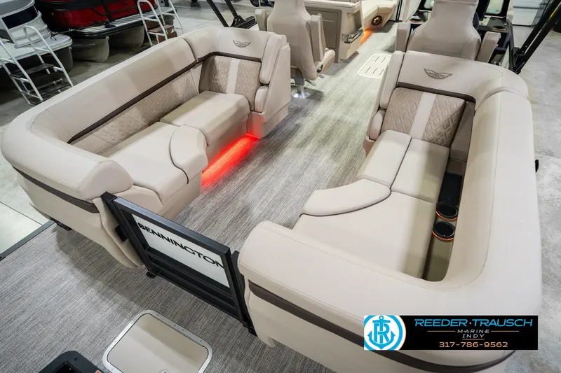Slide: The Image of Luxurious interior of 2026 Bennington 24 MSB pontoon boat with plush seating and ambient lighting. - 16