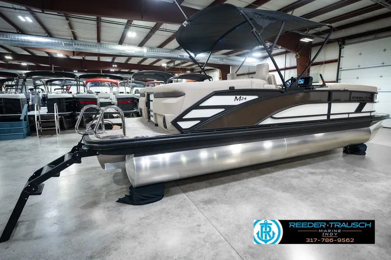 Slide: The Image of 2026 Bennington 24 MSB pontoon boat displayed in indoor showroom. - 8