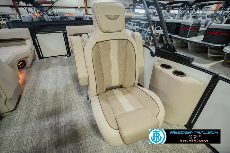 Slide: The Image of Luxurious seating on a 2026 Bennington 24 MSB pontoon boat, featuring elegant beige upholstery. - 34