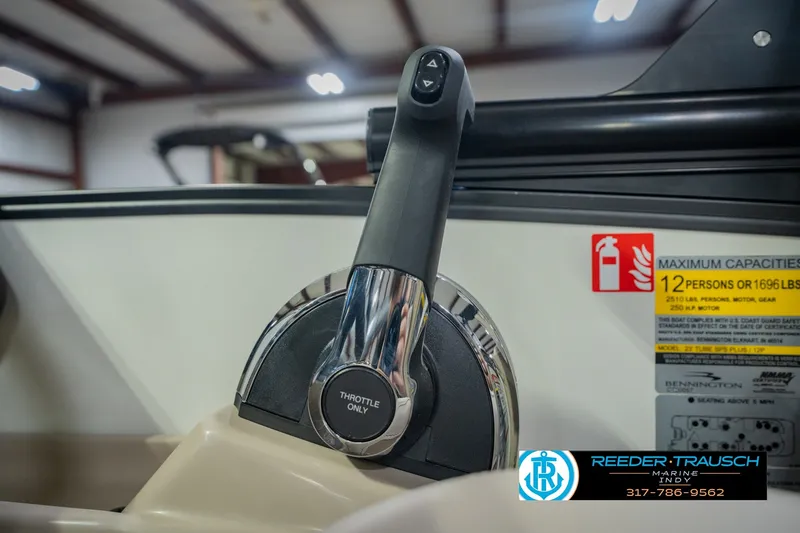 Slide: The Image of Throttle control of 2026 Bennington 24 MSB boat, showing capacity label and safety instructions. - 45