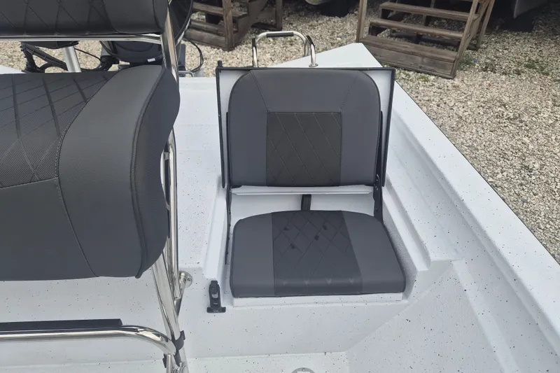 Slide: The Image of 2027 Xpress H20B Bay boat with gray cushioned seating and sleek design. - 14