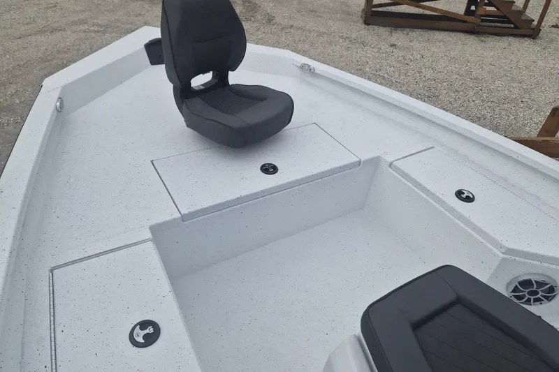 Slide: The Image of 2027 Xpress H20B Bay boat interior with seating and storage compartments. - 19
