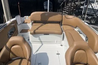 Slide: The Image of 2023 Crownline Eclipse E215 XS boat interior with tan leather seating. - 11