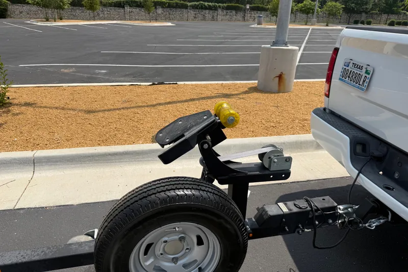 Slide: The Image of Trailer hitch setup on a white truck, featuring a 2020 Tracker Pro 160 model. - 30