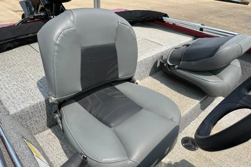 Slide: The Image of 2020 Tracker Pro 160 boat interior with gray seating and steering wheel. - 28