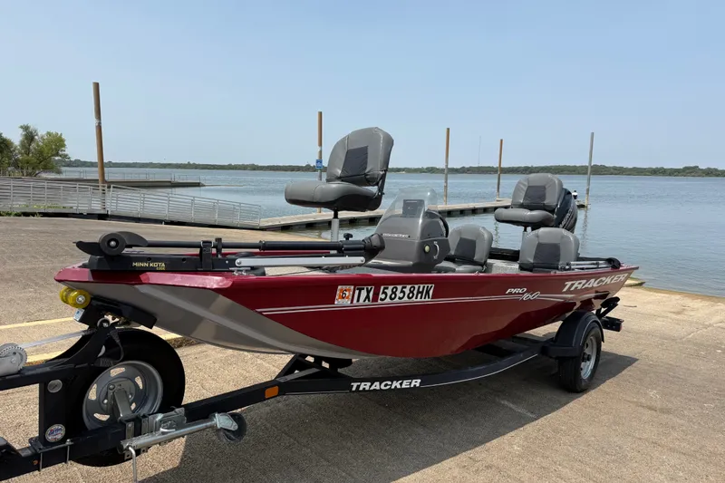 Slide: The Image of 2020 Tracker Pro 160 boat on trailer by a lakeside dock. - 17