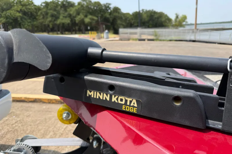 Slide: The Image of Minn Kota Edge trolling motor on 2020 Tracker Pro 160 boat, parked near a lake. - 20
