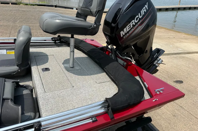 Slide: The Image of 2020 Tracker Pro 160 boat with Mercury engine, featuring gray seating and red trim. - 26