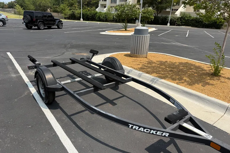 Slide: The Image of Empty 2020 Tracker Pro 160 boat trailer in a parking lot. - 29