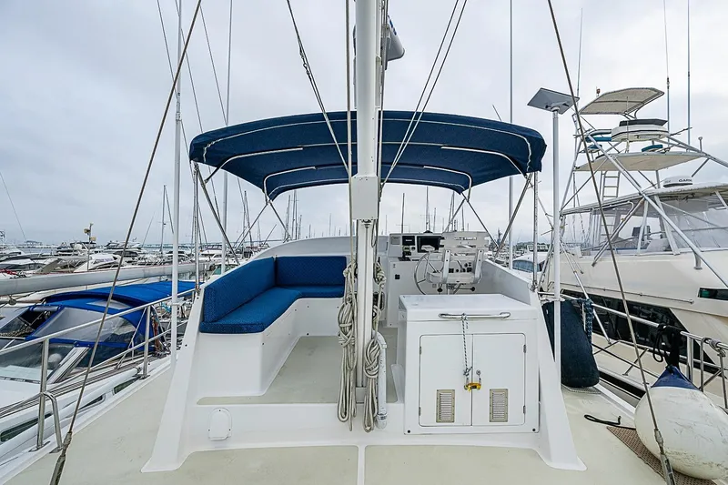 Slide: The Image of 2008 Krogen 48 North Sea yacht with blue canopy, docked in a marina. - 53