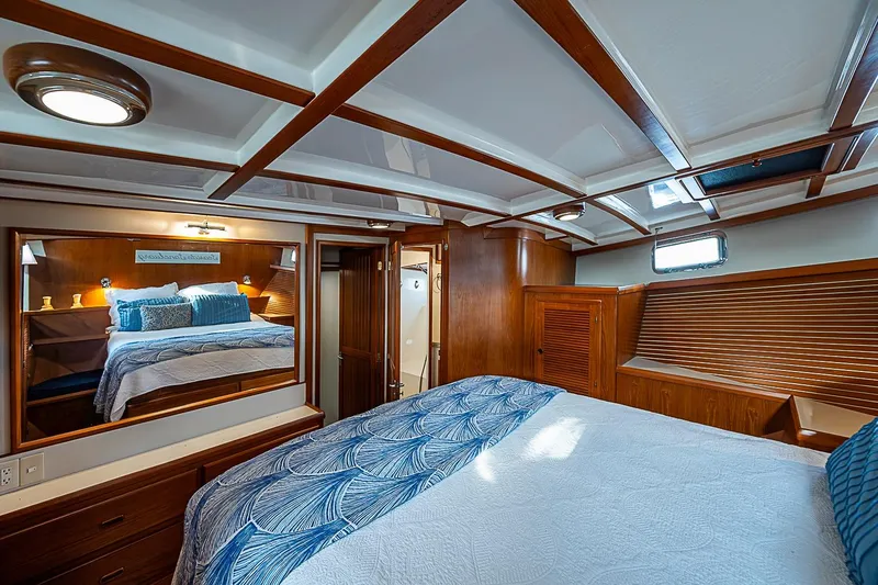 Slide: The Image of Luxurious 2008 Krogen 48 North Sea yacht bedroom with elegant wood finish and cozy bedding. - 30