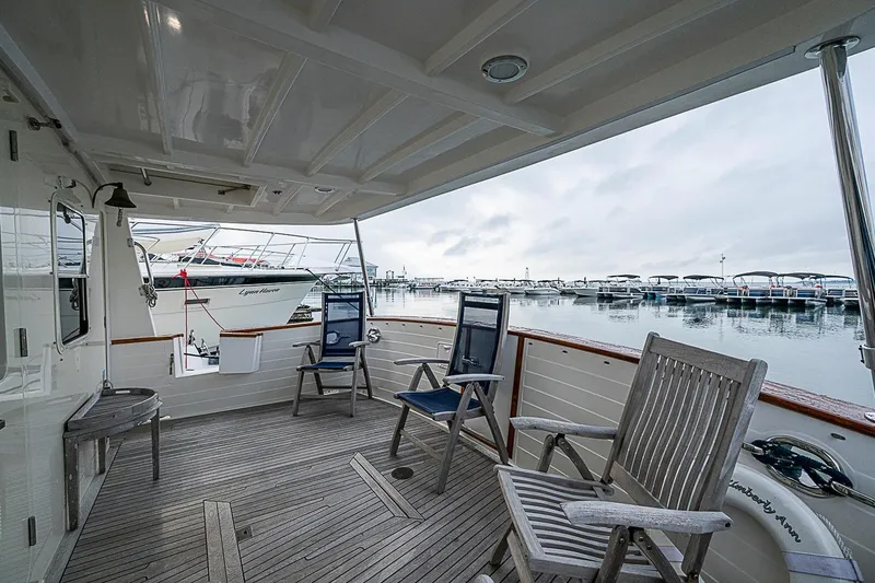Slide: The Image of Deck view of 2008 Krogen 48 North Sea yacht with marina backdrop. - 48