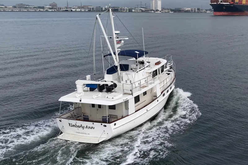 Slide: The Image of 2008 Krogen 48 North Sea yacht cruising in open water, rear view. - 3