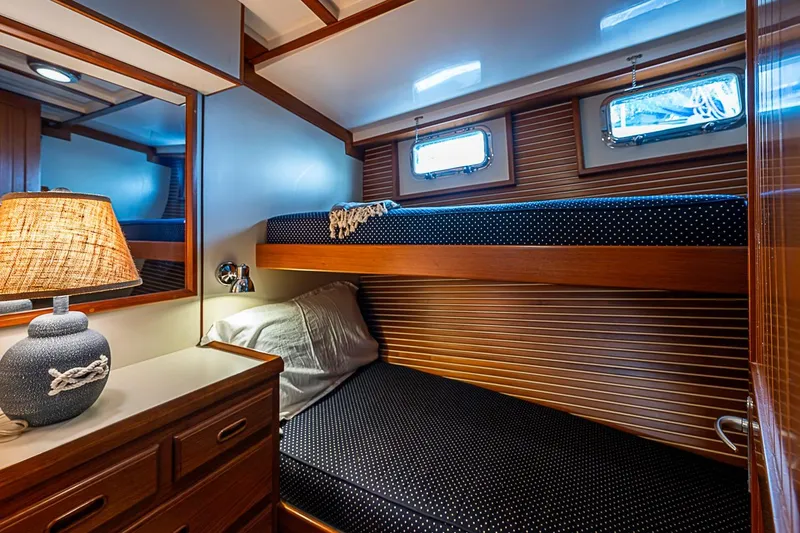 Slide: The Image of Cozy cabin interior of 2008 Krogen 48 North Sea yacht with bunk beds and nautical decor. - 36