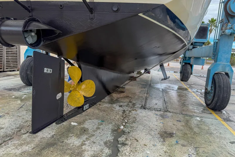 Slide: The Image of Bottom view of 2008 Krogen 48 North Sea boat on dry dock, showcasing propeller and rudder. - 68