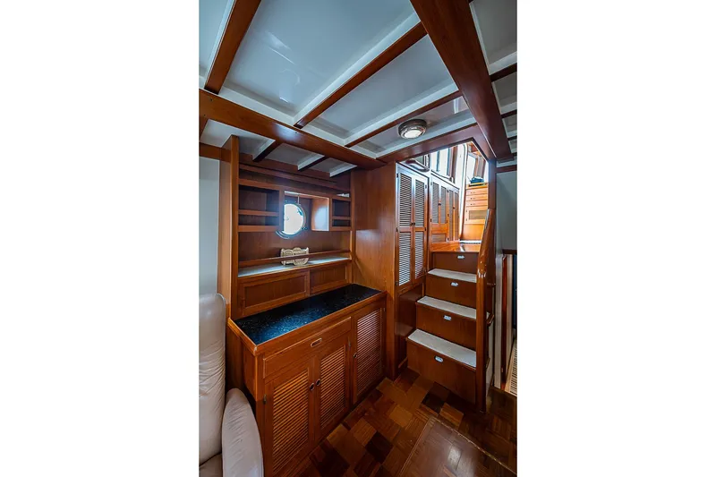 Slide: The Image of Luxurious wooden interior of 2008 Krogen 48 North Sea yacht with stairs and storage. - 18