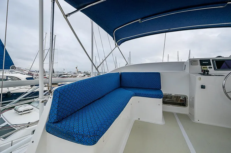 Slide: The Image of 2008 Krogen 48 North Sea yacht cockpit with blue seating and canopy. - 54