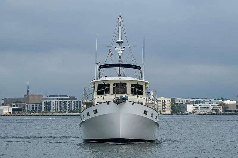 Slide: The Image of 2008 Krogen 48 North Sea yacht cruising near urban waterfront. - 11