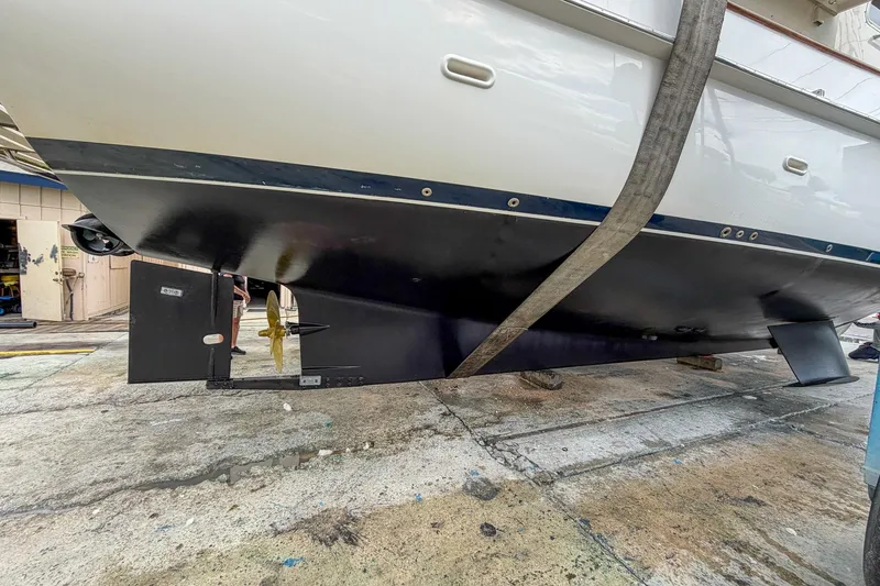 Slide: The Image of 2008 Krogen 48 North Sea yacht hull in dry dock, showcasing propeller and rudder. - 67