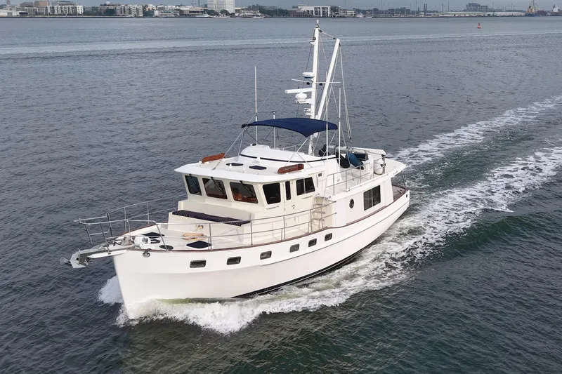 Slide: The Image of 2008 Krogen 48 North Sea yacht cruising on open water, showcasing elegant design and smooth sailing. - 1