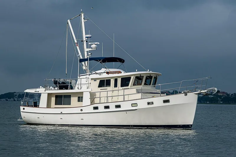 The Image of 2008 Krogen 48 North Sea yacht on calm waters under cloudy sky. - 0