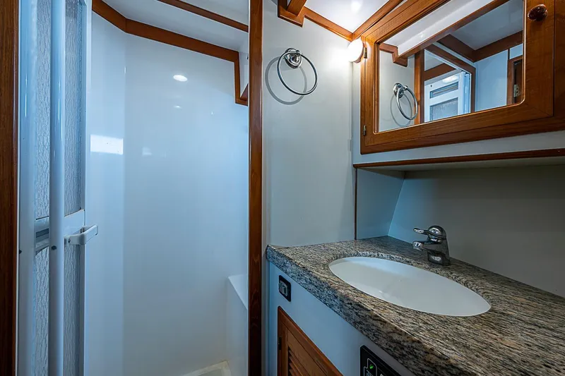 Slide: The Image of Luxurious bathroom in 2008 Krogen 48 North Sea yacht with granite countertop and shower. - 44