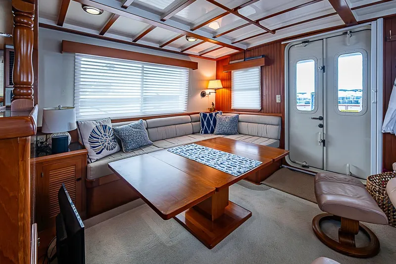 Slide: The Image of Luxurious interior of 2008 Krogen 48 North Sea yacht with elegant seating and wooden accents. - 17