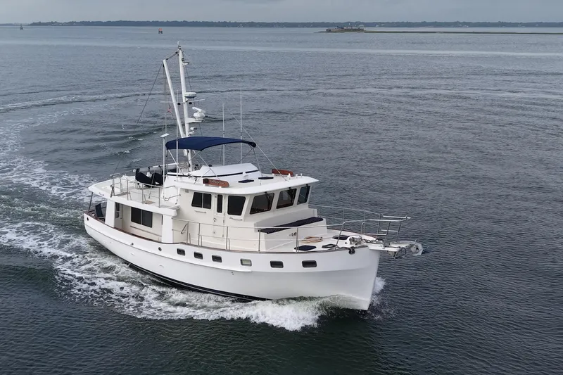 Slide: The Image of 2008 Krogen 48 North Sea yacht cruising on open water. - 2