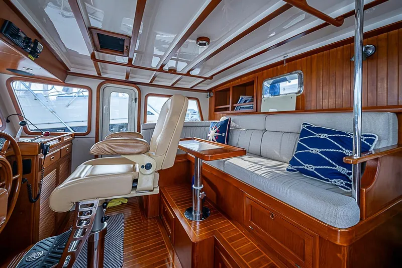 Slide: The Image of Luxurious interior of 2008 Krogen 48 North Sea yacht with plush seating and wooden accents. - 24