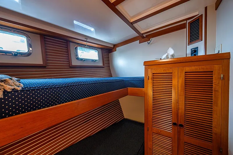 Slide: The Image of Cozy cabin interior of 2008 Krogen 48 North Sea yacht with wooden finishes and porthole windows. - 38