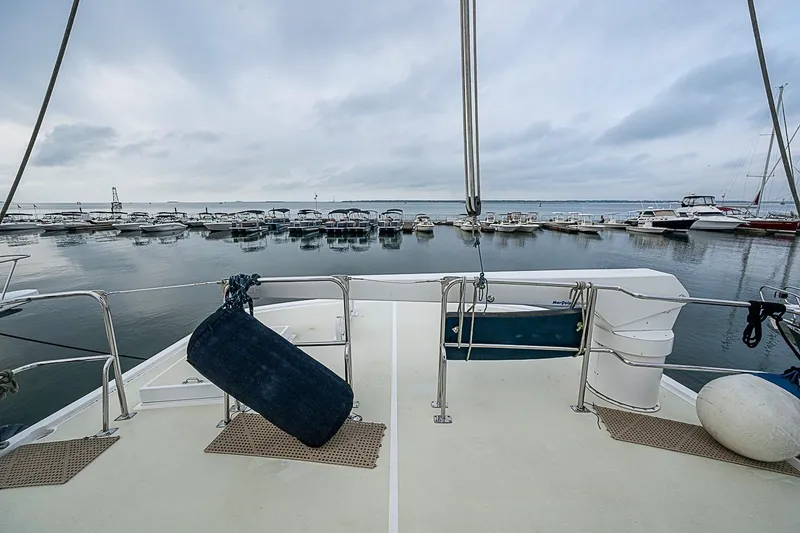 Slide: The Image of Deck view of 2008 Krogen 48 North Sea yacht in a marina setting. - 52
