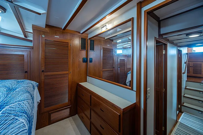 Slide: The Image of Interior of 2008 Krogen 48 North Sea yacht with wooden cabinetry and cozy bedroom. - 32