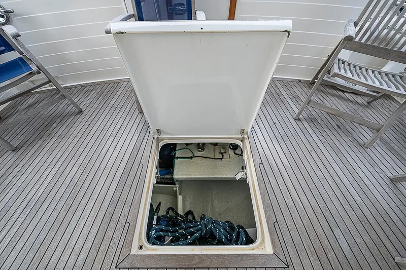 Slide: The Image of Open hatch on 2008 Krogen 48 North Sea yacht deck, revealing storage compartment. - 50