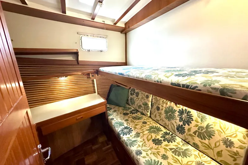 Slide: The Image of Cozy cabin interior of 1997 Kadey-Krogen 48 Whaleback with floral upholstery and wooden accents. - 27