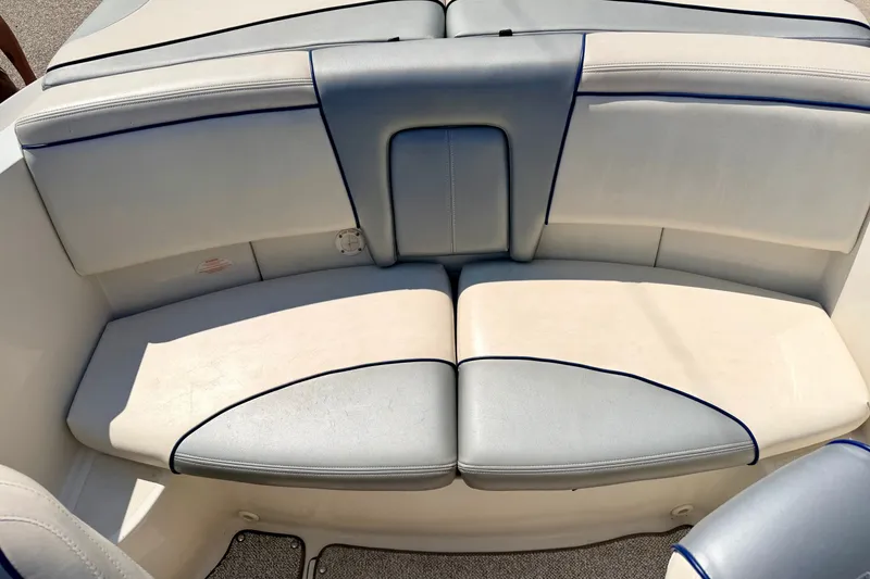 Slide: The Image of 2008 Sea Ray 195 Sport boat interior seating with blue accents. - 32