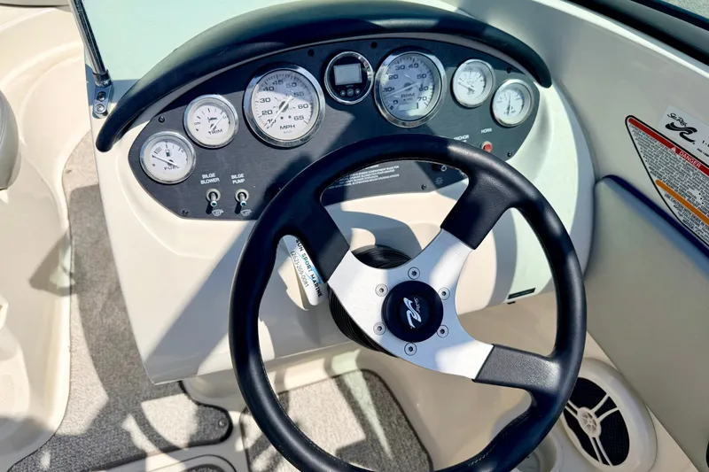 Slide: The Image of Steering wheel and dashboard of a 2008 Sea Ray 195 Sport boat. - 38