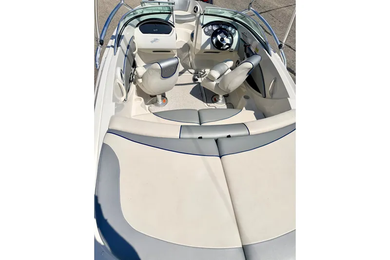 Slide: The Image of 2008 Sea Ray 195 Sport boat interior with white and gray seating. - 24