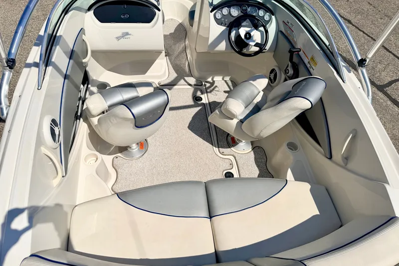 Slide: The Image of 2008 Sea Ray 195 Sport boat interior with steering wheel and seating arrangement. - 31