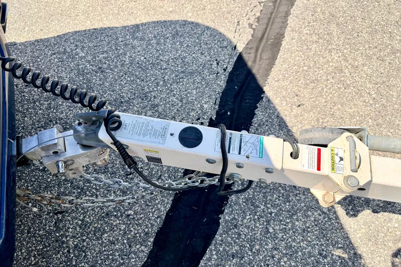 Slide: The Image of Trailer hitch of a 2008 Sea Ray 195 Sport on asphalt surface. - 71