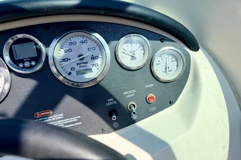 Slide: The Image of Dashboard of a 2008 Sea Ray 195 Sport boat with gauges and controls. - 40