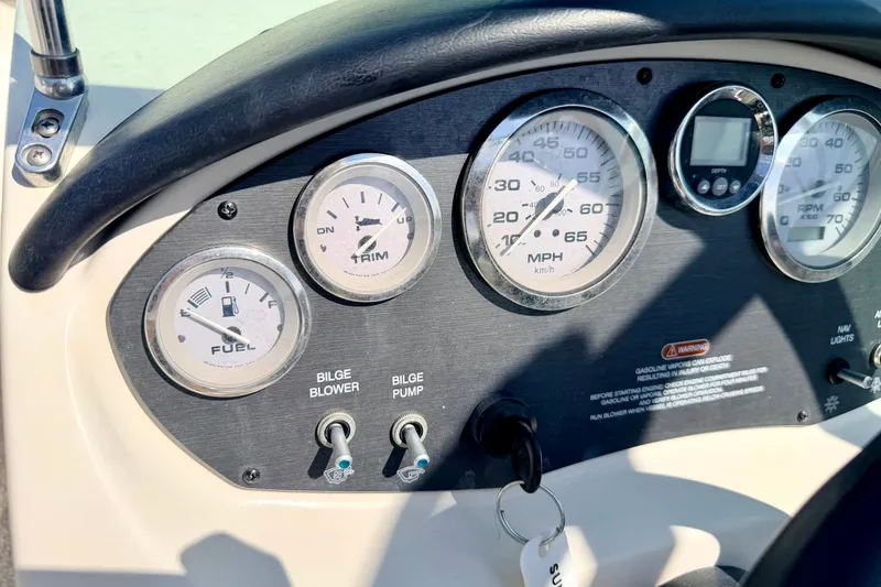 Slide: The Image of Dashboard of a 2008 Sea Ray 195 Sport boat with gauges and controls. - 39