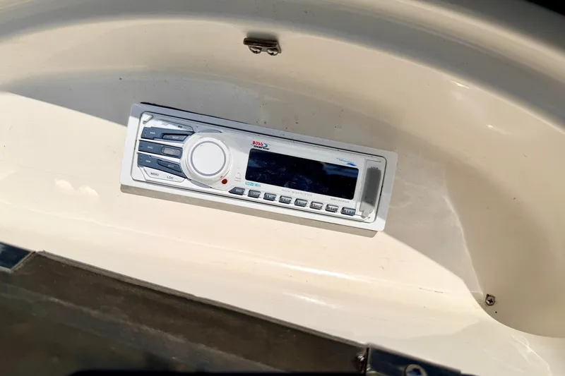 Slide: The Image of Boat stereo system on a 2008 Sea Ray 195 Sport dashboard. - 52